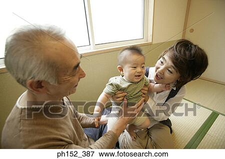 Close-up of a senior couple with their grandson View Large Photo Image Stock Photo - Close-up of a senior couple with their grandson. Fotosearch