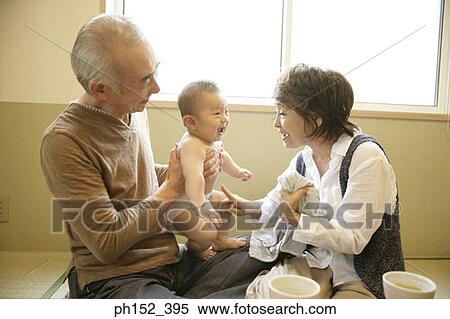 Close-up of a senior couple with their grandson View Large Photo Image Stock Photography - Close-up of a senior couple with their grandson. Fotosearch