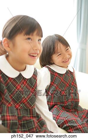 Close-up of two girls smiling View Large Photo Image Stock Photo - Close-up of two girls smiling. Fotosearch