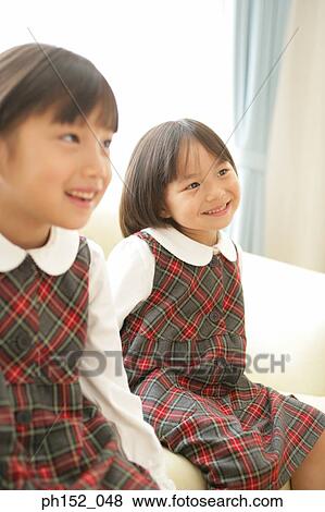 Close-up of two girls smiling View Large Photo Image Stock Photo - Close-up of two girls smiling. Fotosearch