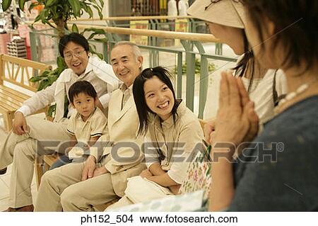 Picture - Family in a shopping mall. Fotosearch