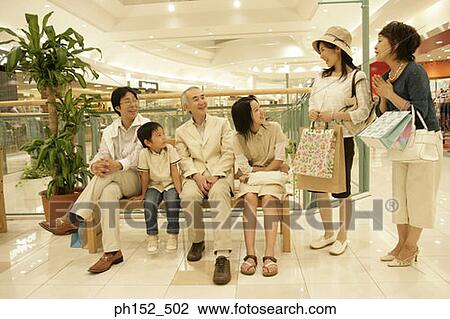 Stock Image - Family in a shopping mall. Fotosearch