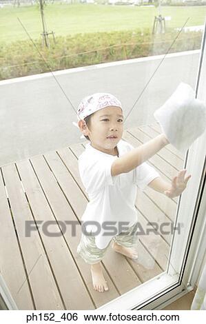 High angle view of a boy cleaning a window View Large Photo Image Stock Photograph - High angle view of a boy cleaning a window. Fotosearch