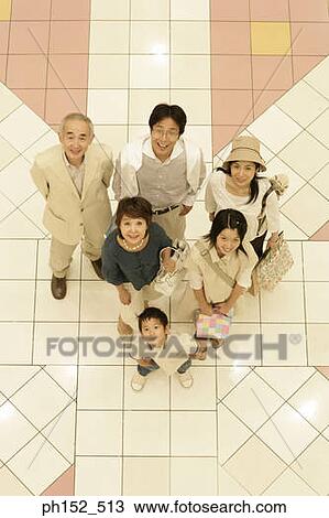 High angle view of a family at a shopping mall View Large Photo Image Stock Image - High angle view of a family at a shopping mall. Fotosearch