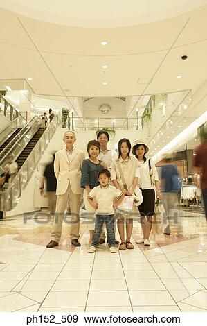 Stock Photo - Portrait of a family at a shopping mall. Fotosearch