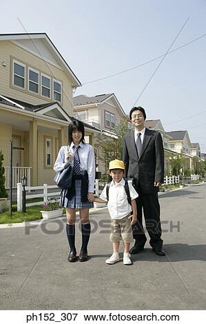 Portrait of a mature man standing with his son and daughter on the road View Large Photo Image Stock Photo - Portrait of a mature man standing with his son and daughter on the road. Fotosearch