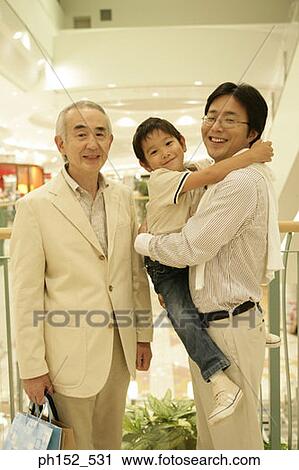 Portrait of a senior man standing beside his son and his grandson View Large Photo Image Stock Image - Portrait of a senior man standing beside his son and his grandson. Fotosearch