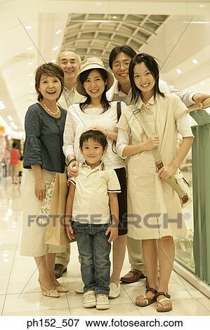 Portrait of a three generation family at a shopping mall View Large Photo Image Stock Photo - Portrait of a three generation family at a shopping mall. Fotosearch