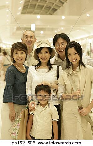 Portrait of a three generation family at a shopping mall View Large Photo Image Stock Photograph - Portrait of a three generation family at a shopping mall. Fotosearch