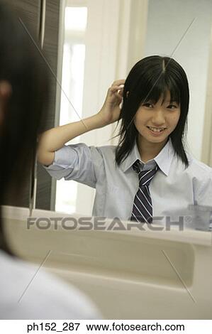 Reflection of a teenage girl in a mirror View Large Photo Image Stock Photo - Reflection of a teenage girl in a mirror. Fotosearch