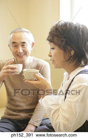 Senior couple holding cups View Large Photo Image Stock Image - Senior couple holding cups. Fotosearch