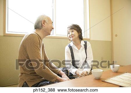 Senior couple sitting together View Large Photo Image Stock Photo - Senior couple sitting together. Fotosearch