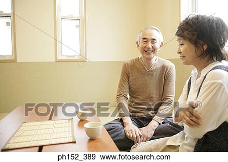 Stock Photo - Senior couple sitting together. Fotosearch