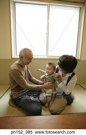 Senior couple with their grandson View Large Photo Image Stock Photography - Senior couple with their grandson. Fotosearch