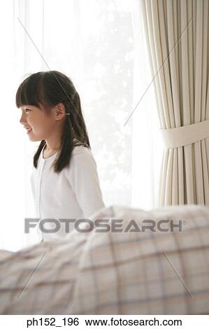 Side profile of a girl smiling View Large Photo Image Stock Photograph - Side profile of a girl smiling. Fotosearch
