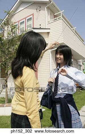 Side profile of a mature woman and her daughter smiling View Large Photo Image Stock Image - Side profile of a mature woman and her daughter smiling. Fotosearch