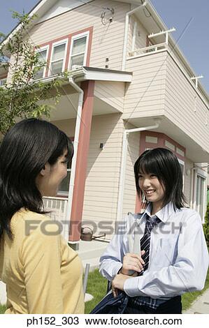 Side profile of a mature woman and her daughter smiling View Large Photo Image Stock Image - Side profile of a mature woman and her daughter smiling. Fotosearch