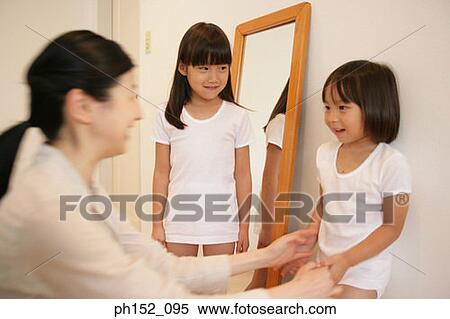 Side profile of a mid adult woman and her daughters smiling View Large Photo Image Stock Photography - Side profile of a mid adult woman and her daughters smiling. Fotosearch