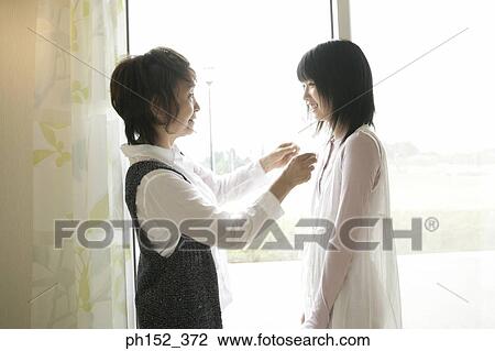 Side profile of a senior woman looking at her granddaughter and smiling View Large Photo Image Stock Image - Side profile of a senior woman looking at her granddaughter and smiling. Fotosearch