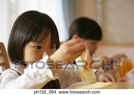 Two girls at the dining table View Large Photo Image Picture - Two girls at the dining table. Fotosearch