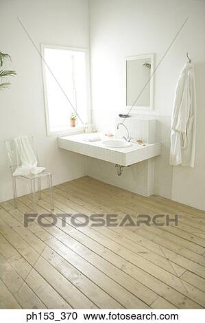 Stock Image - Bathroom sink beside a window. Fotosearch