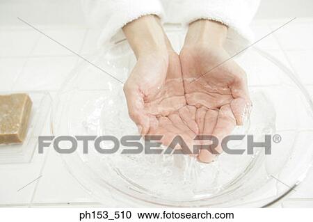 High angle view of human hands on a bowl of water View Large Photo Image Stock Image - High angle view of human hands on a bowl of water. Fotosearch