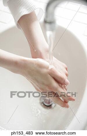 High angle view of human hands under flowing water View Large Photo Image Stock Image - High angle view of human hands under flowing water. Fotosearch