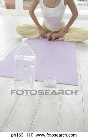 Low section view of a woman exercising View Large Photo Image Stock Image - Low section view of a woman exercising. Fotosearch