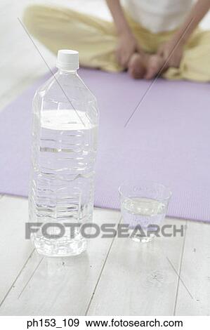 Stock Photo - Low section view of a woman exercising. Fotosearch