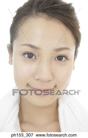 Portrait of a young woman smiling View Large Photo Image Stock Photo - Portrait of a young woman smiling. Fotosearch