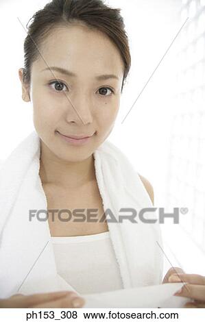 Stock Photo - Portrait of a young woman smiling. Fotosearch