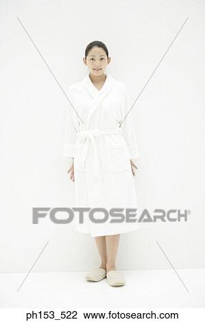 Portrait of a young woman wearing a bathrobe and standing View Large Photo Image Stock Image - Portrait of a young woman wearing a bathrobe and standing. Fotosearch