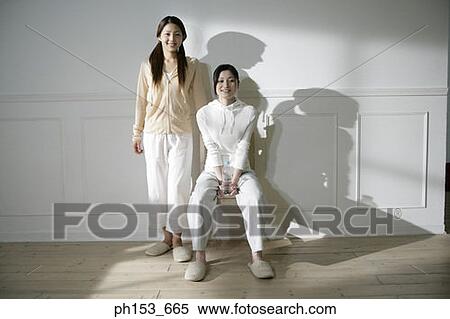 Portrait of two sisters smiling View Large Photo Image Stock Photography - Portrait of two sisters smiling. Fotosearch