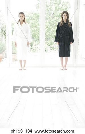 Portrait of two young women standing View Large Photo Image Picture - Portrait of two young women standing. Fotosearch