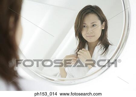 Reflection of a young woman in a mirror View Large Photo Image Picture - Reflection of a young woman in a mirror. Fotosearch
