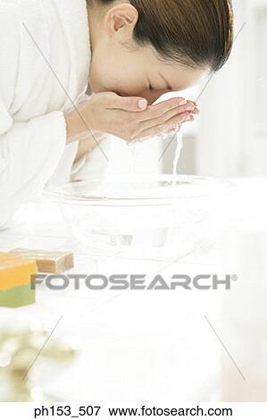 Side profile of a young woman washing her face View Large Photo Image Stock Photo - Side profile of a young woman washing her face. Fotosearch