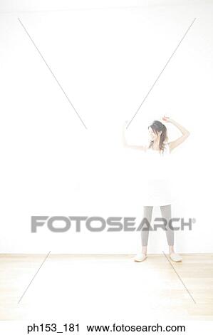 Young woman holding a tape measure View Large Photo Image Stock Image - Young woman holding a tape measure. Fotosearch