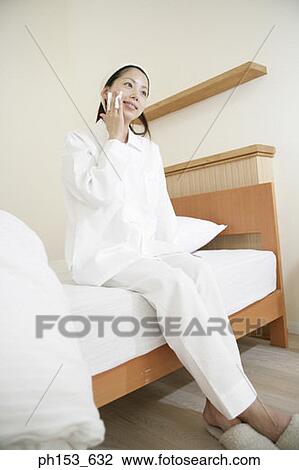 Young woman wiping her face with a handkerchief View Large Photo Image Stock Image - Young woman wiping her face with a handkerchief. Fotosearch
