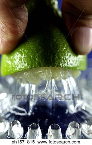 A hand pressing a lime View Large Photo Image Stock Photography - A hand pressing a lime . Fotosearch