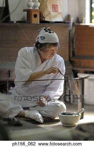 Blacksmith working on a sword in a workshop View Large Photo Image Stock Image - Blacksmith working on a sword in a workshop. Fotosearch