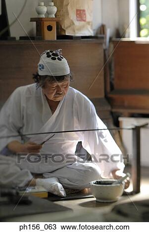 Blacksmith working on a sword in a workshop View Large Photo Image Stock Image - Blacksmith working on a sword in a workshop. Fotosearch