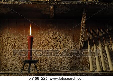 Burning candle in a workshop View Large Photo Image Stock Photography - Burning candle in a workshop. Fotosearch