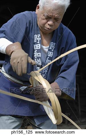 Stock Photography - Carpenter holding cane. Fotosearch