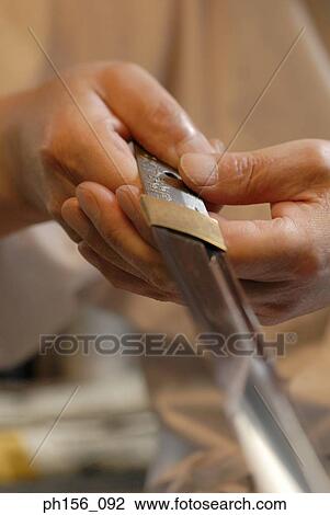 Close-up of a blacksmith's hand holding a sword View Large Photo Image Stock Image - Close-up of a blacksmith's hand holding a sword. Fotosearch