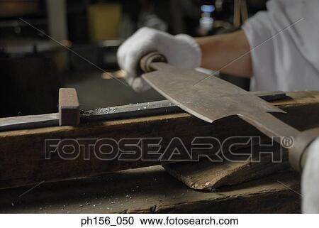Close-up of a blacksmith's hand working with a chisel View Large Photo Image Stock Image - Close-up of a blacksmith's hand working with a chisel. Fotosearch