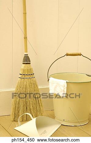 Close-up of a broom stick and a dustpan near a bucket View Large Photo Image Stock Image - Close-up of a broom stick and a dustpan near a bucket. Fotosearch