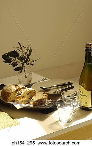 Close-up of a cake and a wine bottle with glasses on the dining table View Large Photo Image Stock Photography - Close-up of a cake and a wine bottle with glasses on the dining table. Fotosearch