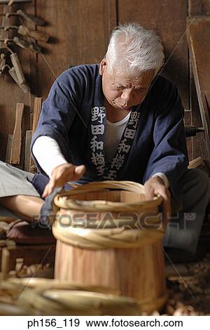 Close-up of a carpenter making a barrel View Large Photo Image Stock Photo - Close-up of a carpenter making a barrel. Fotosearch
