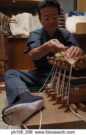 Stock Photograph - Close-up of a carpenter making a samisen. Fotosearch