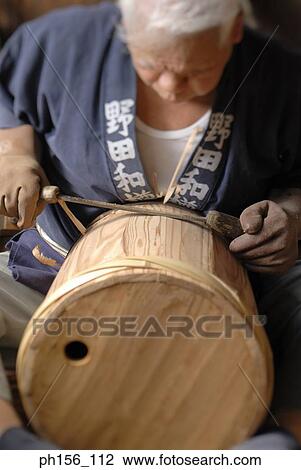 Close-up of a carpenter planing a barrel View Large Photo Image Stock Image - Close-up of a carpenter planing a barrel. Fotosearch